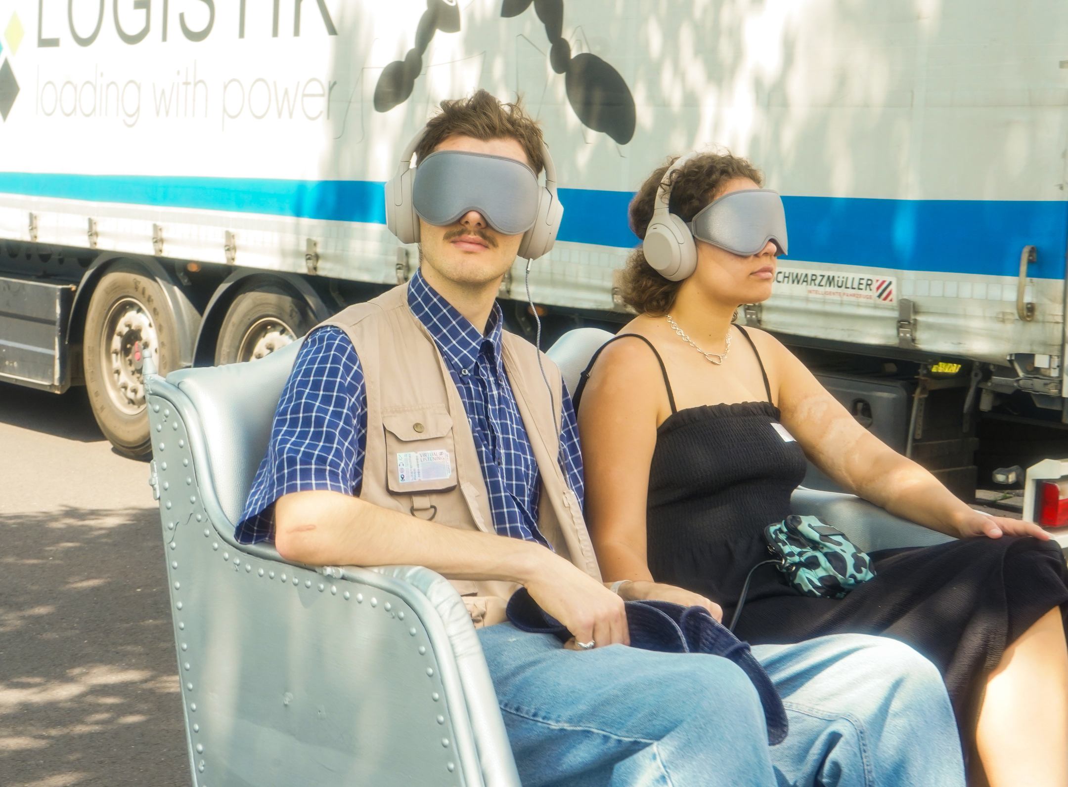 Participant seated in custom-built rickshaw blindfolded for immersive sound journey at LINZ FMR 23 in Linz Austria